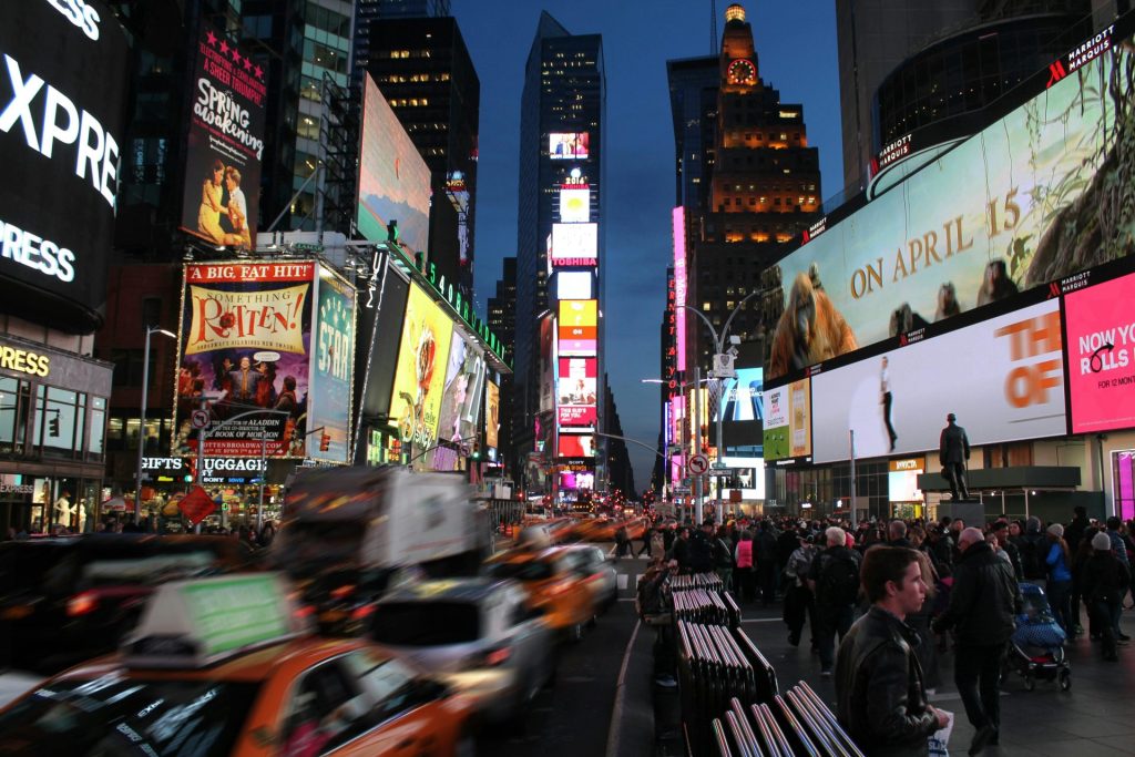 Dynamic night scene capturing the bustling energy and iconic billboards of Times Square, New York City.